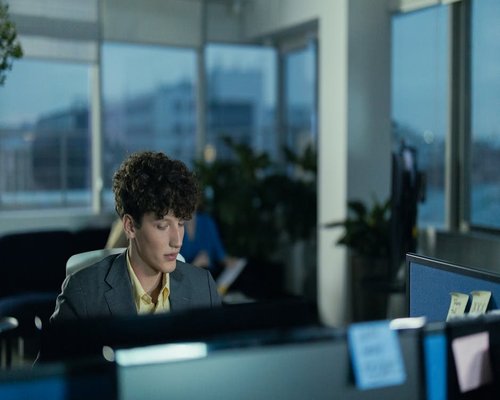 focused man working in a modern city office environment